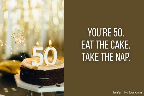 Birthday cake with lighted '50' candles, with quote on the right side