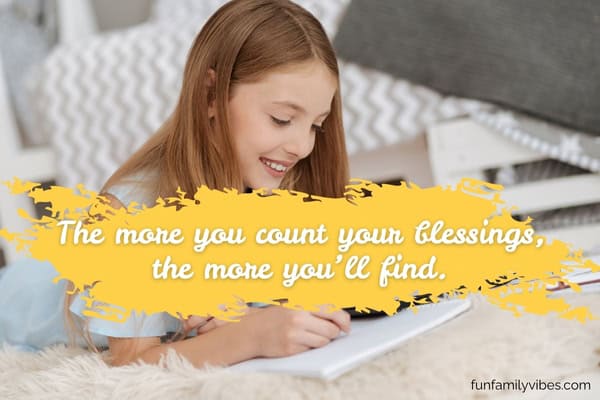 Smiling girl writing with quote overlay