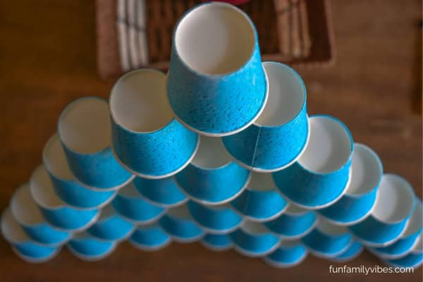 paper cups stacked into a tall pyramid