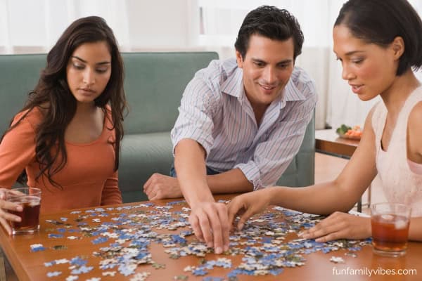 friends working on a jigsaw puzzle