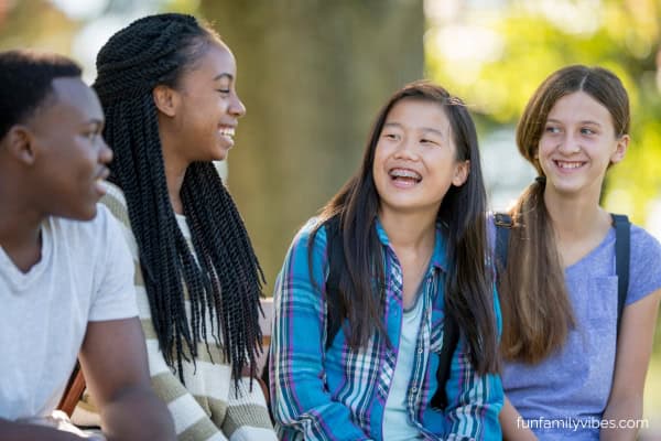 group of teen friends laughing