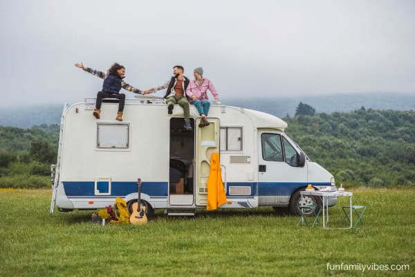 friends in a camper van for a road trip