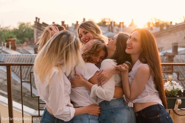 female friends hugging at a bachelorette party
