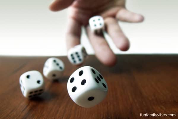 hand rolling 5 dice 