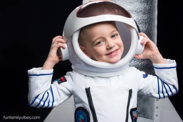 kid wearing an astronaut costume