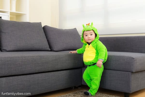 cute toddler wearing a dinosaur costume