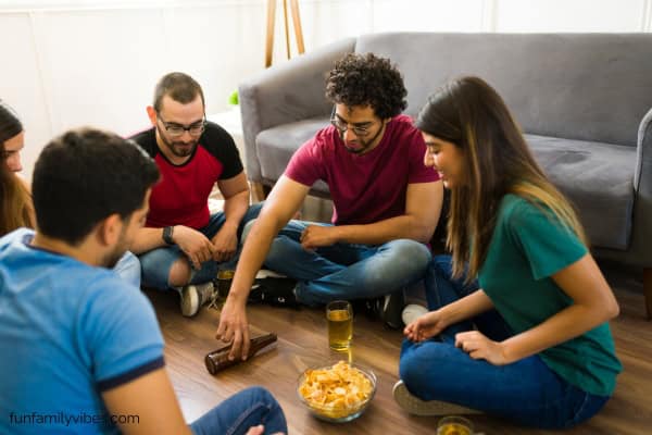 group of college friends playing truth or dare