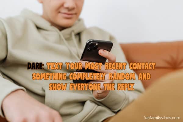 teenage boy using his cellphone with question overlay