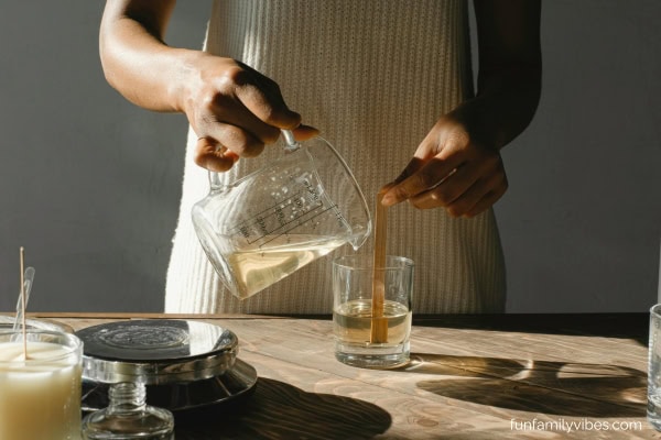 woman making candles