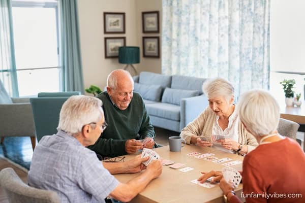 senior citizens playing cards