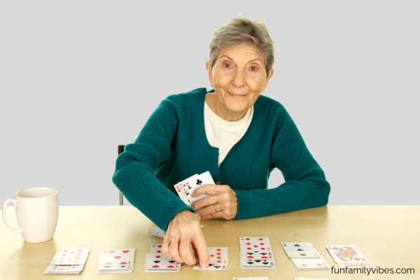 senior woman playing solitaire
