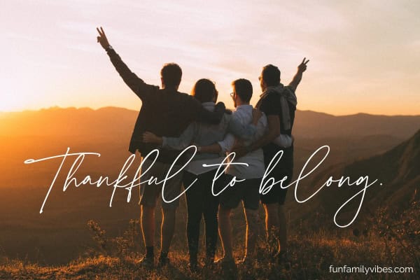 friends with arms around each other on hill facing the sunset with quote overlay