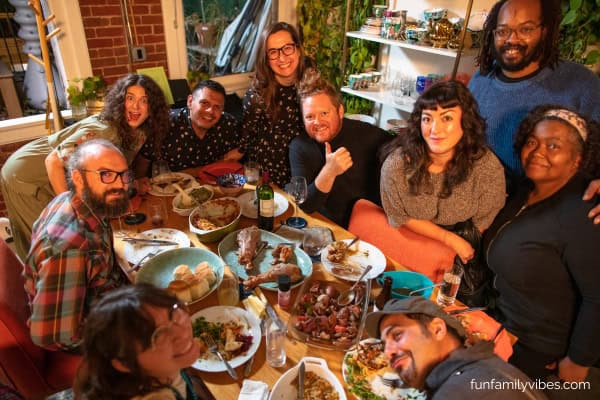 group of friends having a Friendsgiving party dinner